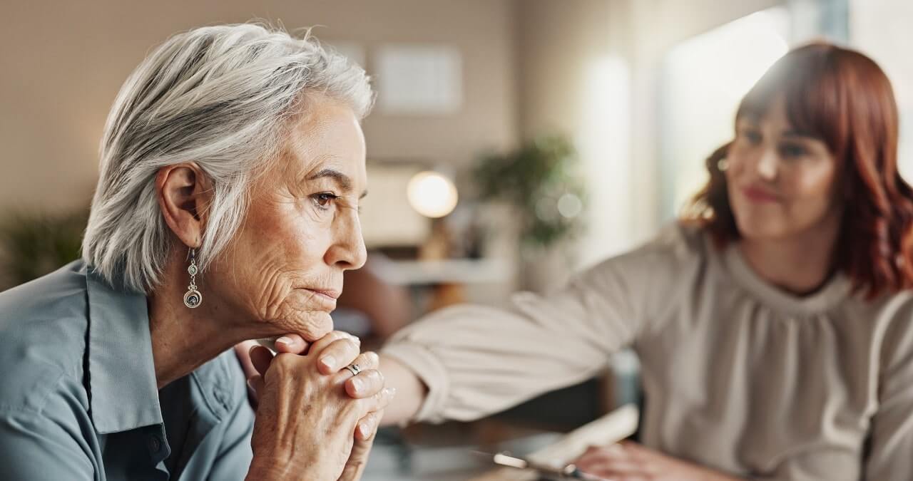 woman consoling another woman