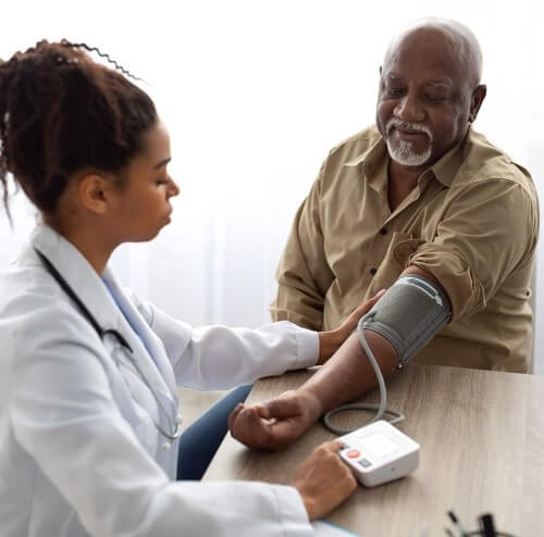 patient getting their blood pressure checked