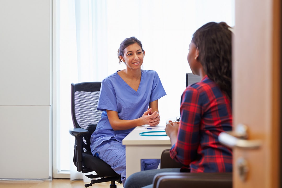 nurse talking to patient