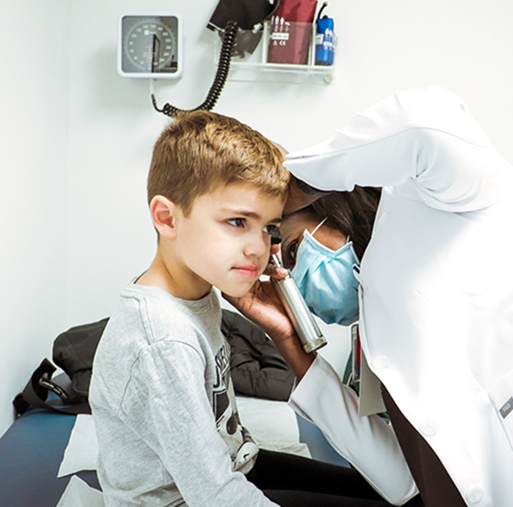 doctor checking a childs ear