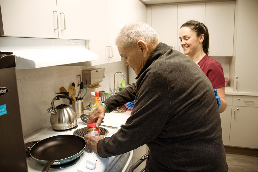 elderly man cooking