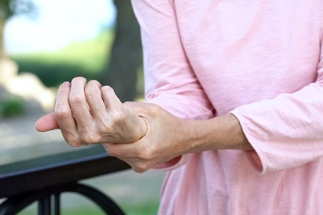 person holding their wrist