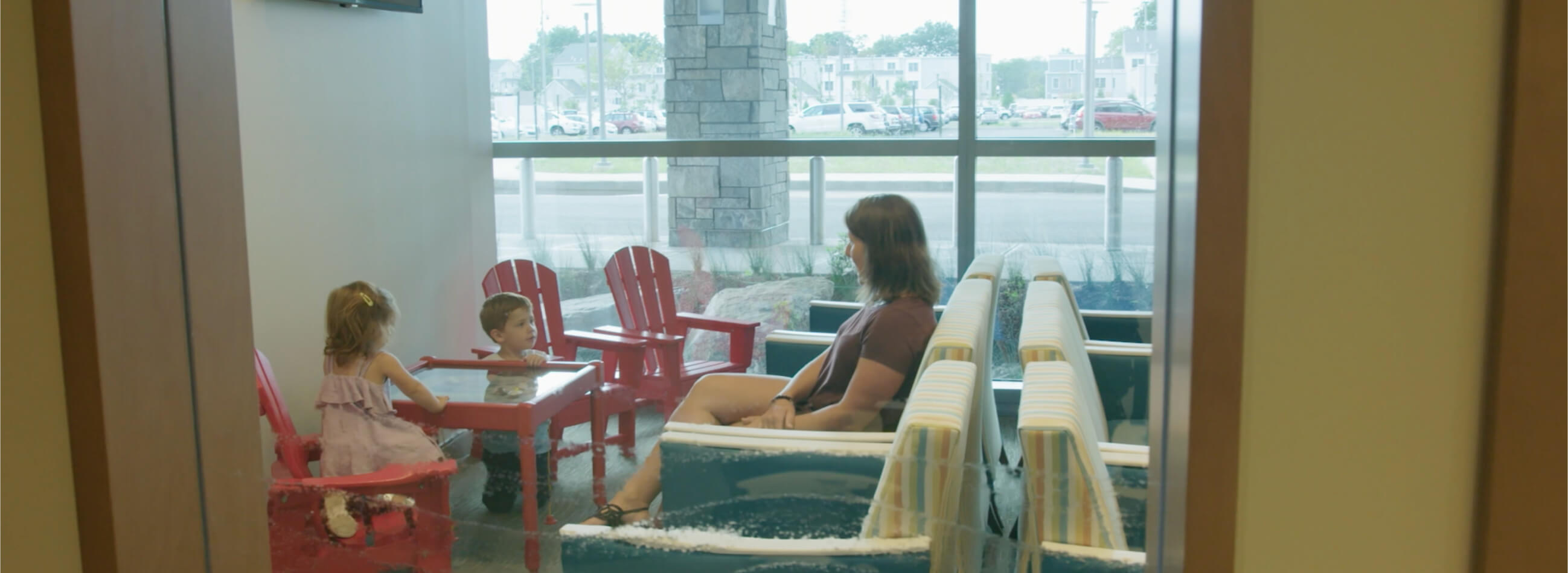 a mom and her kids in the waiting room