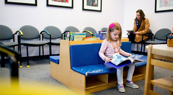 a mother and daughter in the waiting room